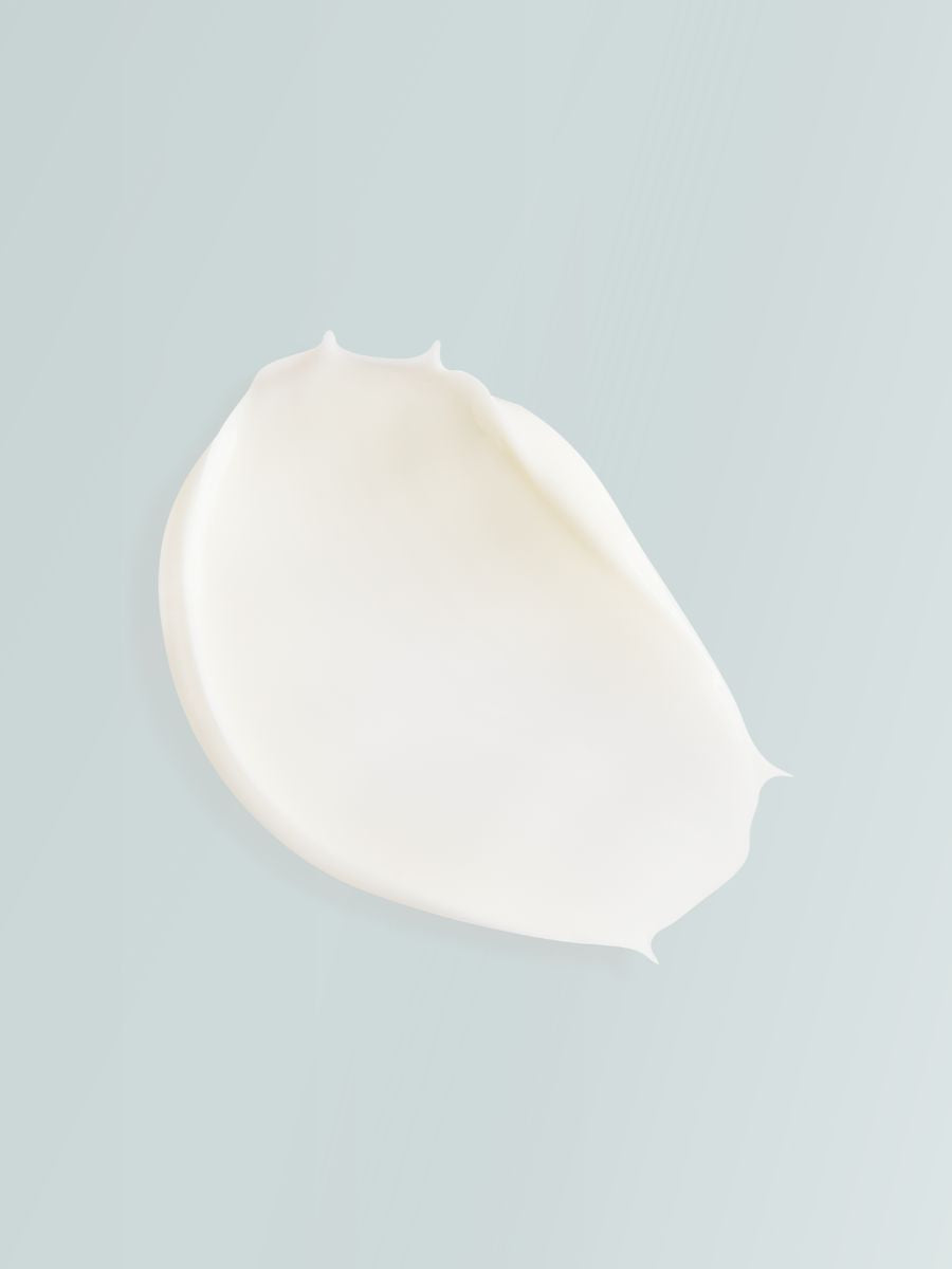 Smooth white cream texture of Magrada Organic Cosmetics black elderberry extract lotion on light background