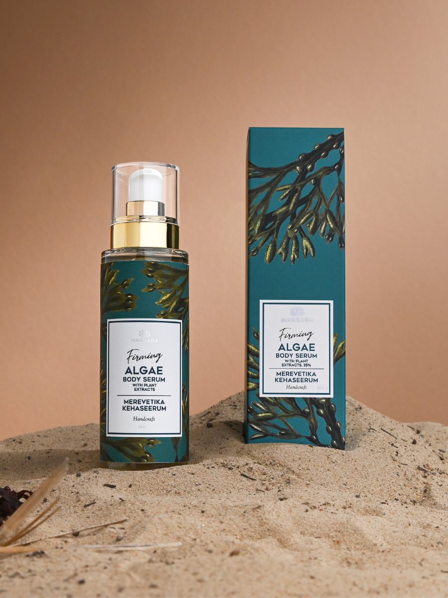 Magrada Organic Cosmetics firming algae body serum bottle and packaging on sand background
