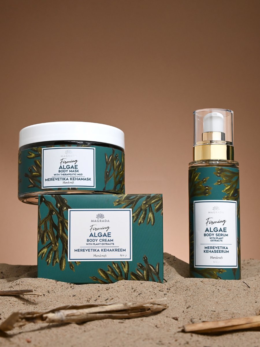 Magrada Organic Cosmetics firming body kit purchase featuring algae body mask cream and serum in green packaging on sandy background