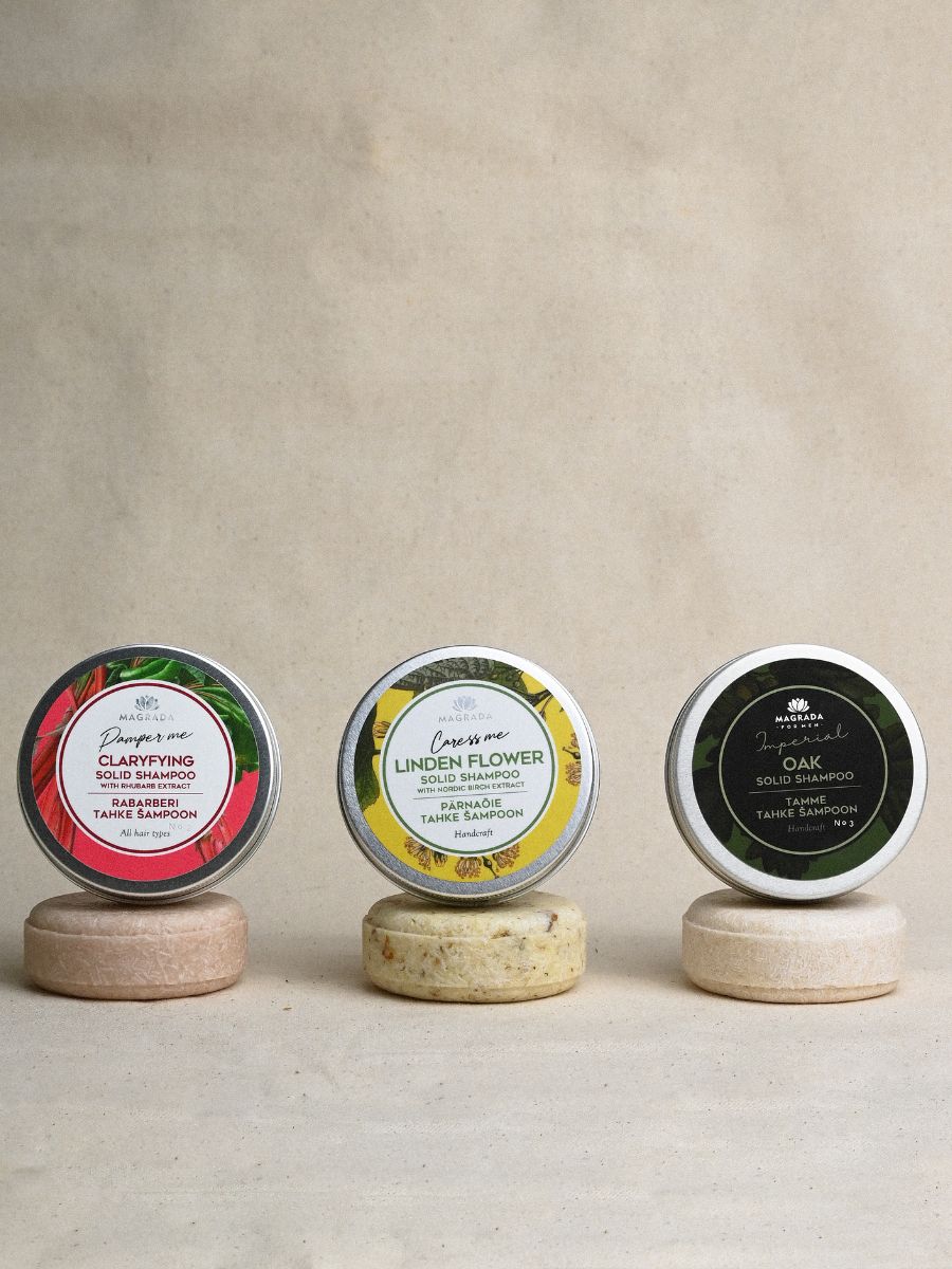 Magrada Organic Cosmetics rhubarb extract shampoo solid bars displayed on eco-friendly stands with different flower scents