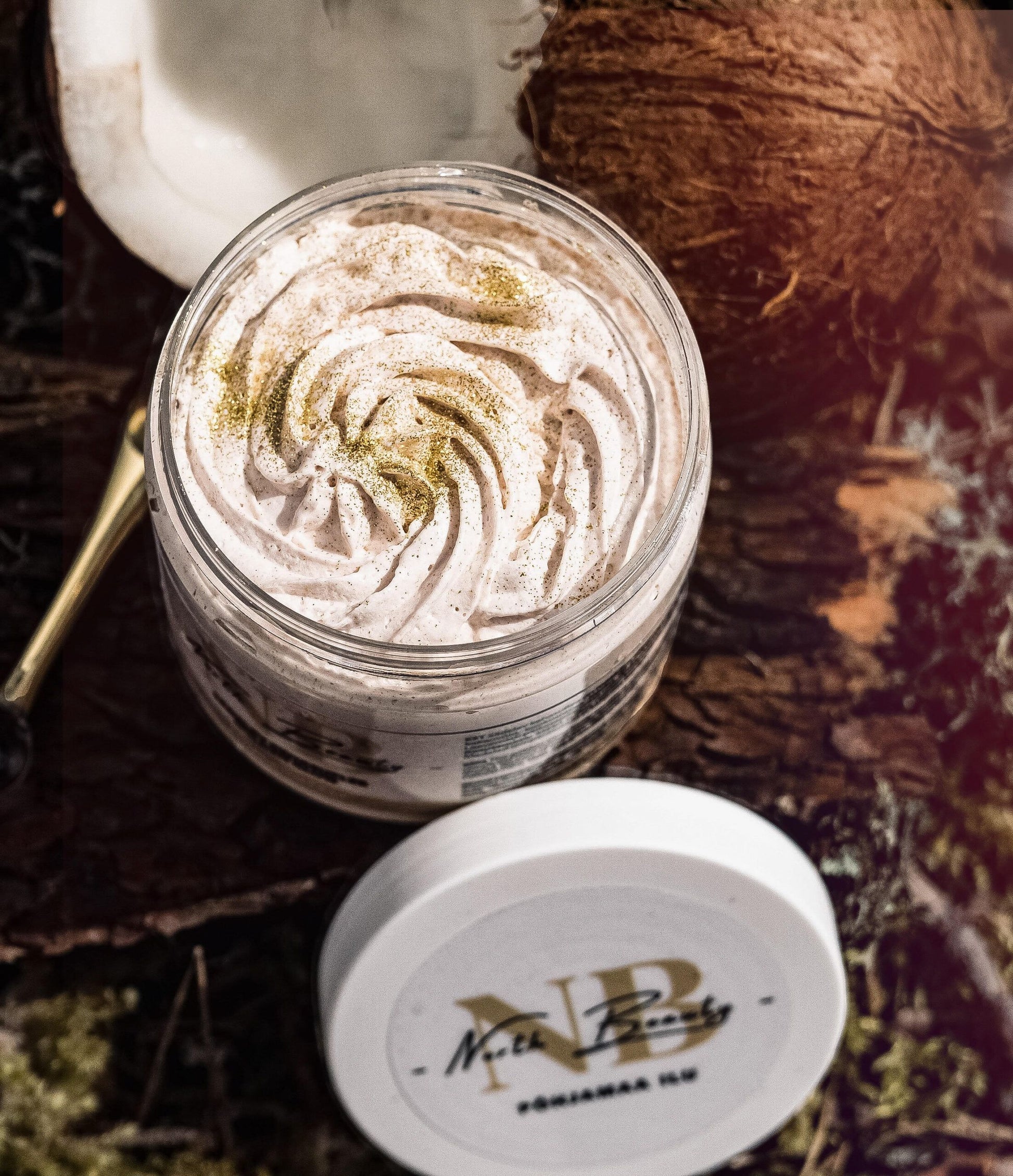 North Beauty body scrub in jar with creamy texture and coconut on rustic wooden background
