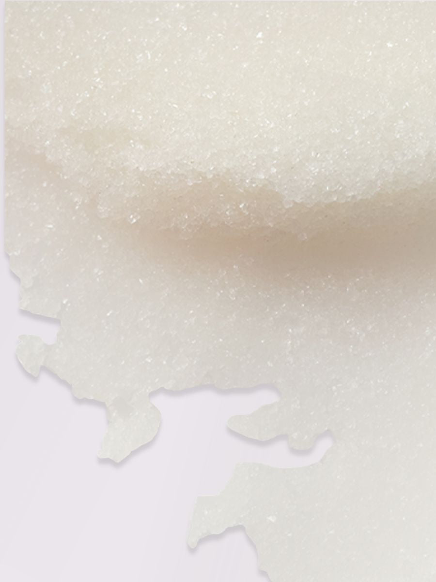 Close-up texture of Magrada Organic Cosmetics organic peony body scrub with sugar crystals
