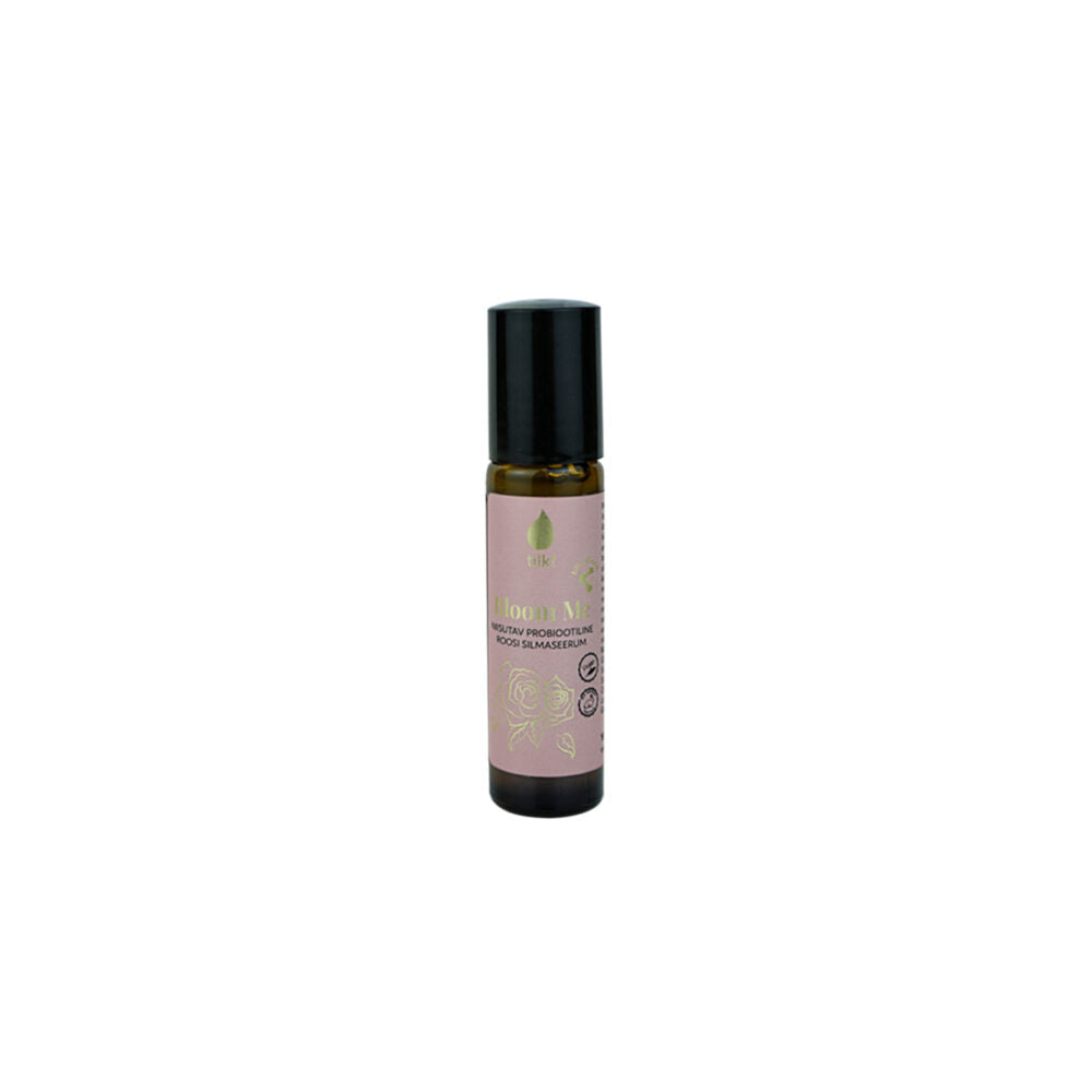 Tilk probiotic rose eye serum in a small brown bottle with a black cap and pink label