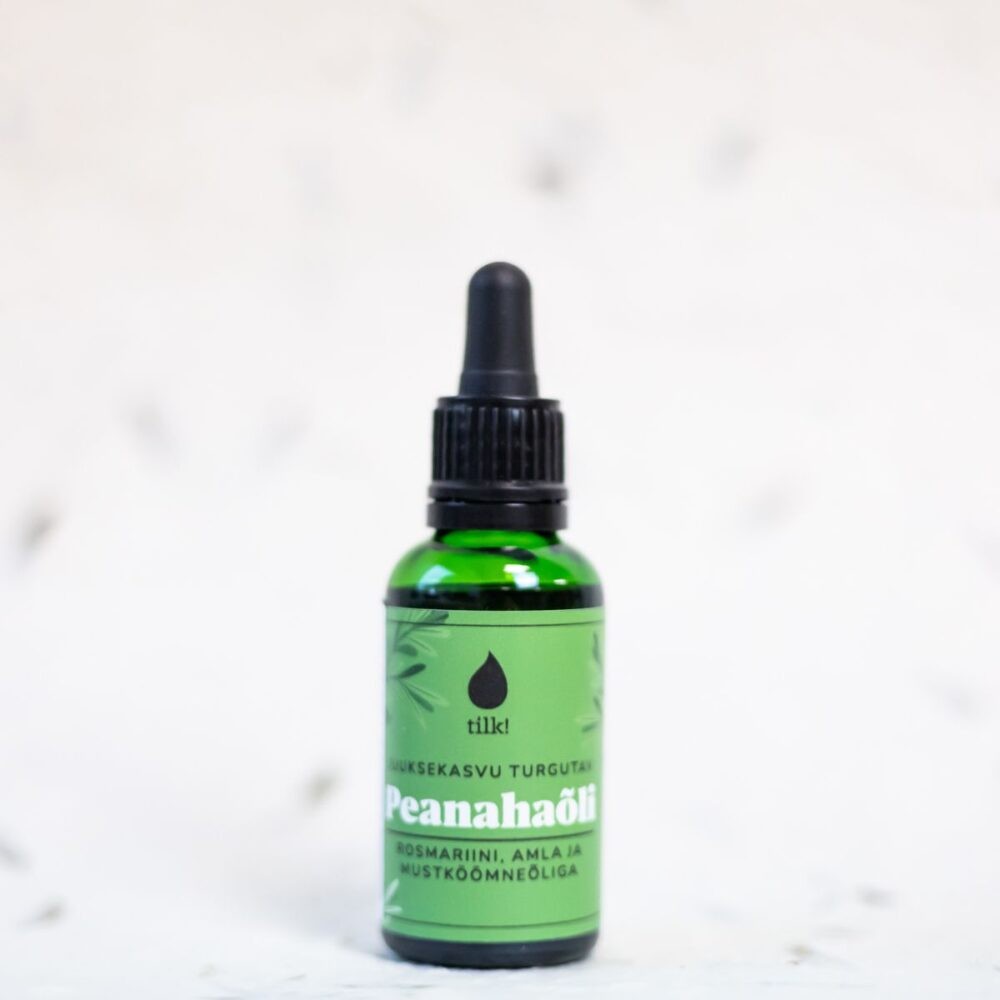Tilk green glass dropper bottle of Peanahaöli herbal oil with rosemary and amla on label