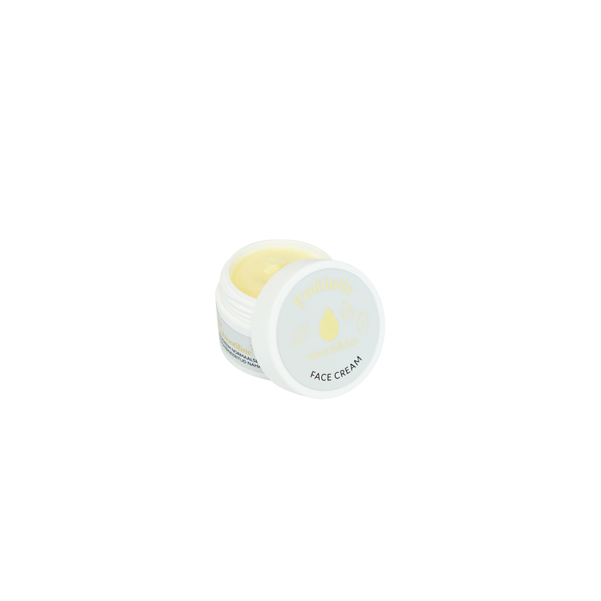 Tilk probiotic face cream in white jar with yellow cream inside for skin hydration