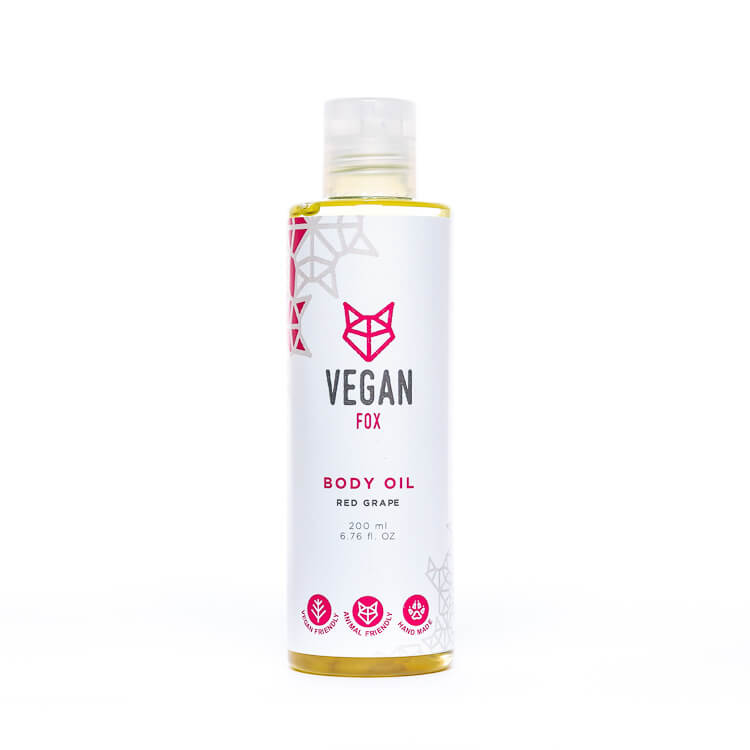 Vegan Fox red grape body oil in a clear plastic bottle with white label and pink logo